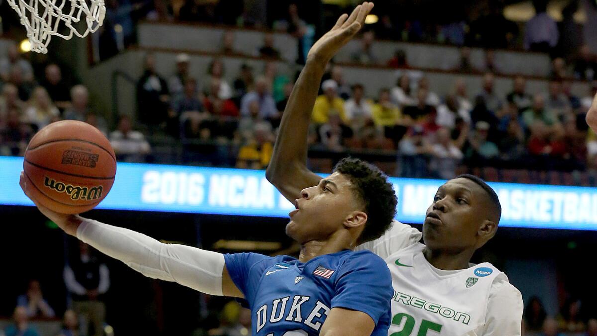 Duke guard Derryck Thornton Jr. drives past Oregon forward Dillon Brooks for a layup in the first half of the NCAA Tournament West Regional game on March 24.