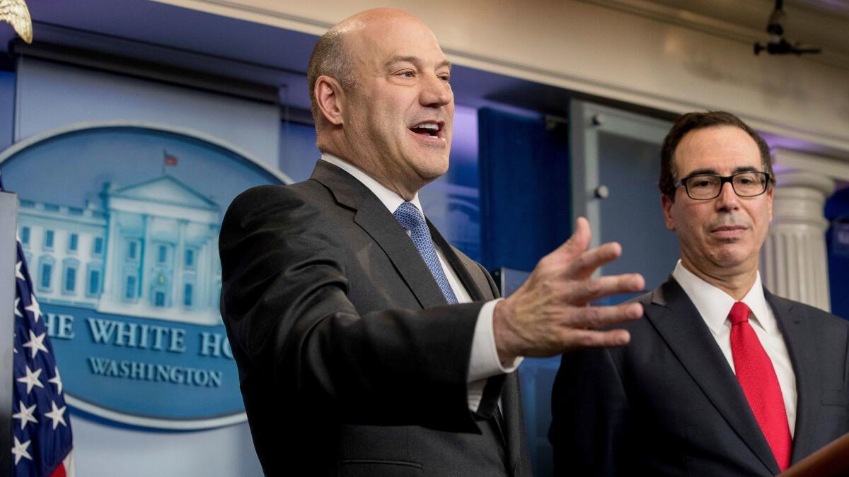 National Economic Director Gary Cohn, left, accompanied by Treasury Secretary Steve Mnuchin, right, speaks in the briefing room of the White House in Washington, Wednesday, April 26, 2017, where they discussed President Donald Trump tax proposals. (AP Photo/Andrew Harnik)