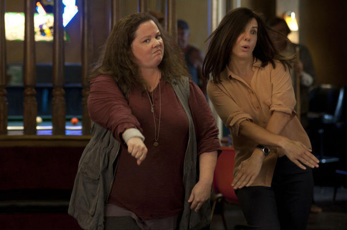 Melissa McCarthy and Sandra Bullock in a scene from "The Heat."
