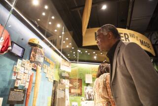 Hall of Fame player Eddie Murray views the new exhibit titled "The Souls of the Game: Voices of Black Baseball."