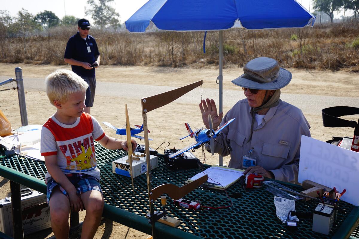 Harbor Soaring Society member Ted Broberg explains flight controls at a 2019 open house event in Fairview Park.