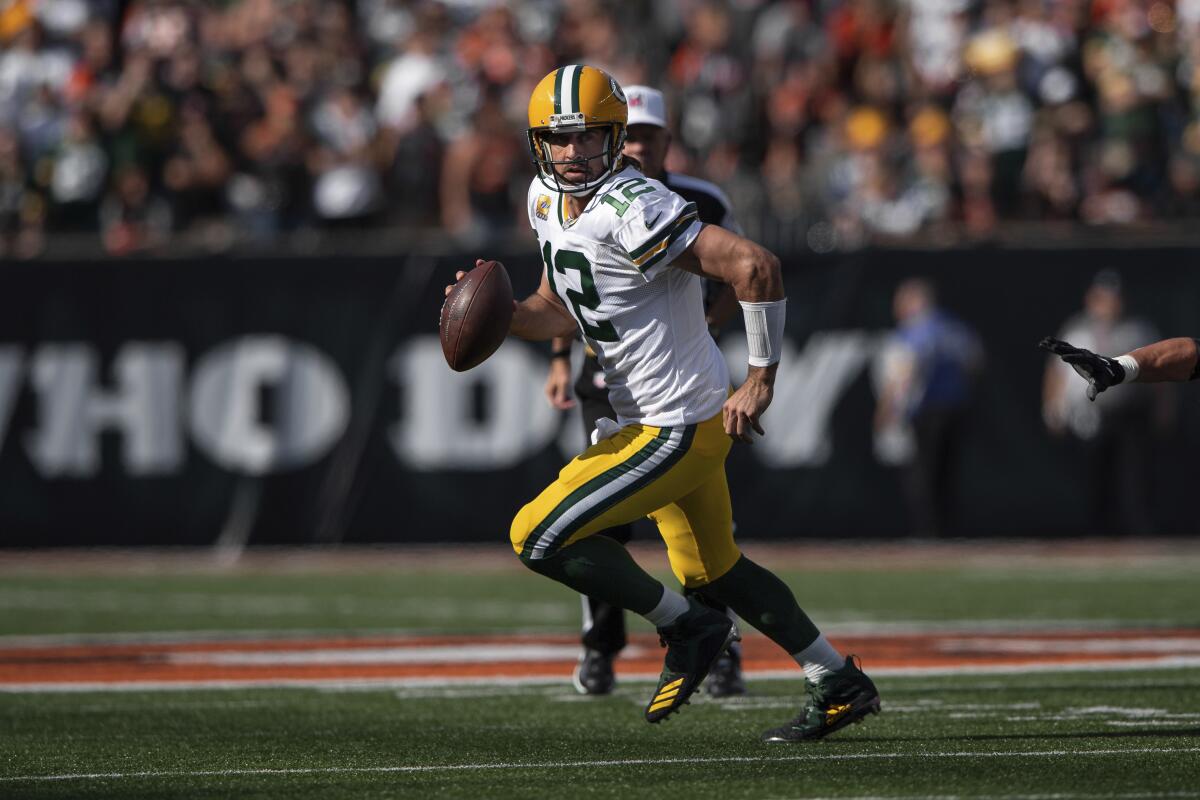 Green Bay Packers quarterback Aaron Rodgers scrambles during a win over the Cincinnati Bengals on Sunday.