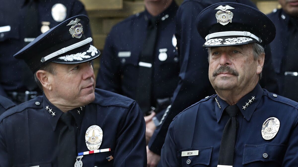 LAPD Assistant Chief Michel Moore, left, and Chief Charlie Beck outside of LAPD headquarters.