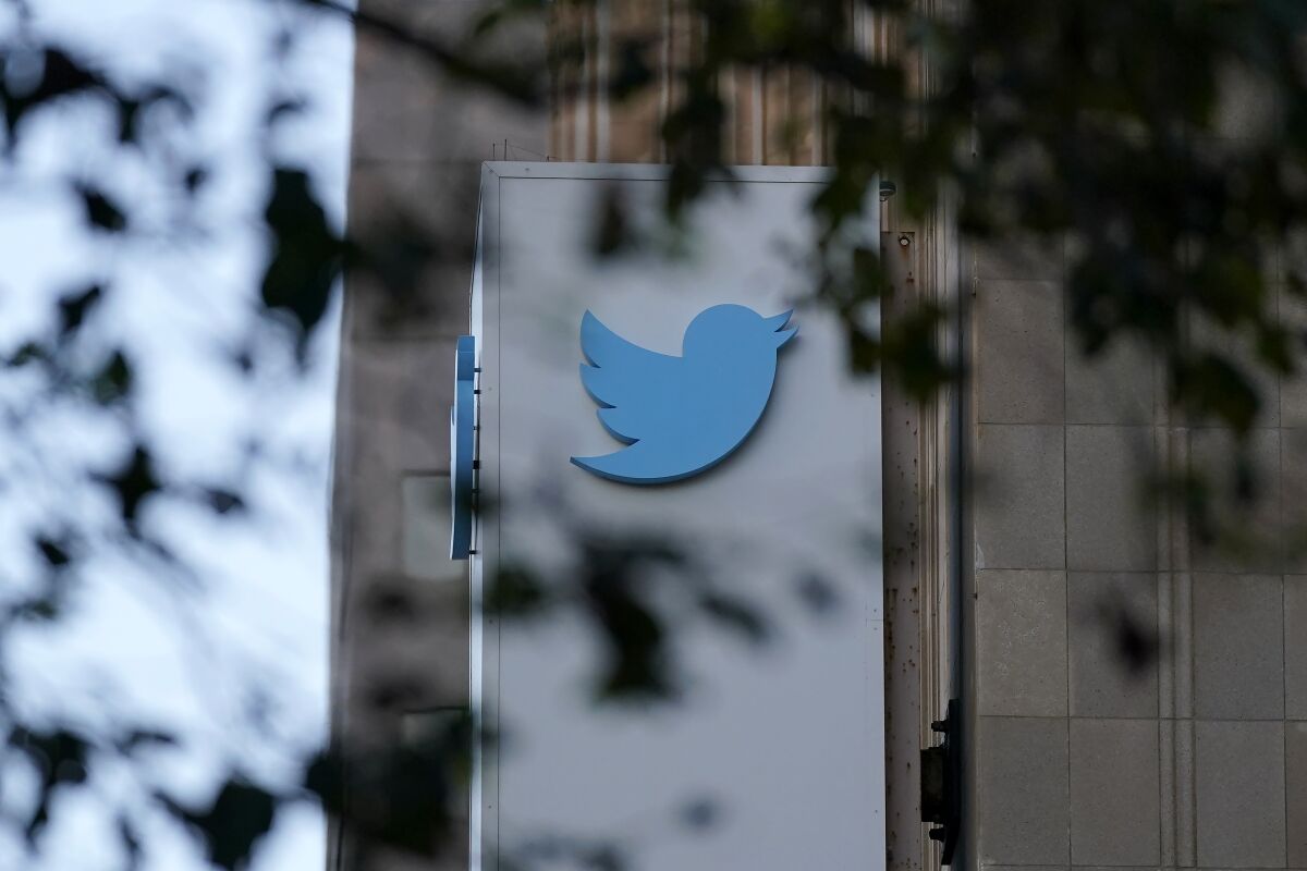 The Twitter logo on the side of a building.
