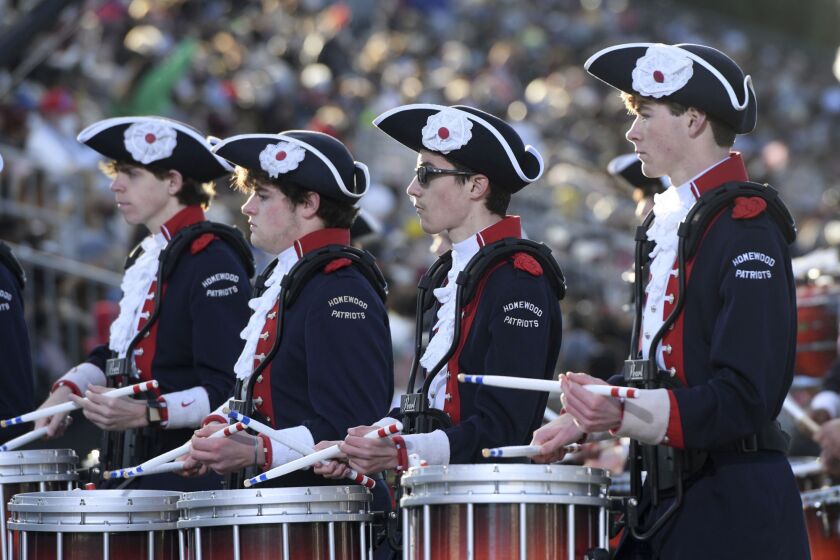 FILE - Members of the Homewood High School Patriot Band from Homewood, Ala., perform during the 133rd Rose Parade in Pasadena, Calif., on Saturday, Jan. 1, 2022. Members of the band have tested positive for COVID-19 since returning home, and the entire school switched to virtual classes because of an outbreak. (AP Photo/Michael Owen Baker, File)