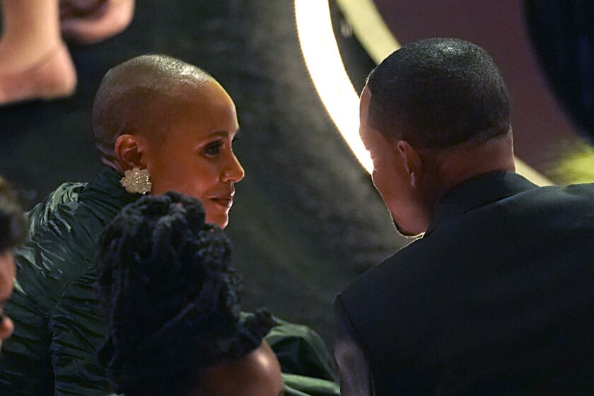 Jada Pinkett Smith, left, and Will Smith appear in the audience at the Oscars on Sunday, March 27, 2022, at the Dolby Theatre in Los Angeles. (AP Photo/Chris Pizzello)