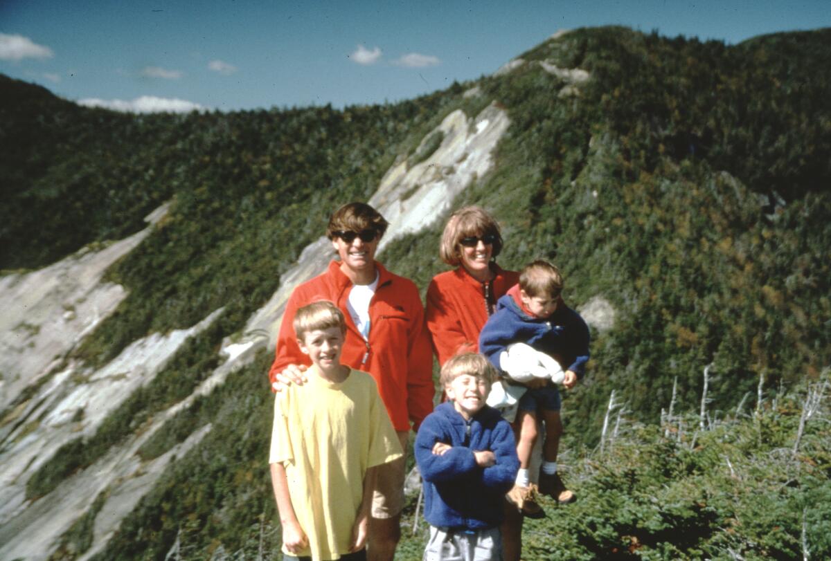 A man, a woman and three children on a mountain ridge in the documentary "Torn."