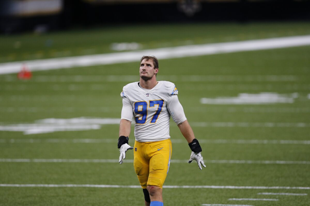 Chargers defensive end Joey Bosa (97) walks off the field after losing to the New Orleans Saints in overtime in October.