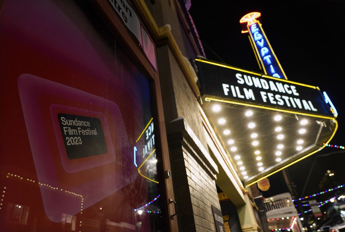 A poster advertises the 2023 Sundance Film Festival in front of the Egyptian Theatre, Wednesday, Jan. 18, 2023, in Park City, Utah. The annual independent film festival runs from Jan. 19-29. (AP Photo/Chris Pizzello)