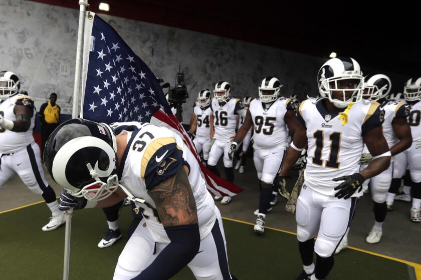 LOS ANGELES, CA, SUNDAY, NOVEMBER 12, 2017 - Rams defensive end Morgan Fox leads the team to the field before a game against the Houstan Texans at the Coliseum. (Robert Gauthier/Los Angeles Times)