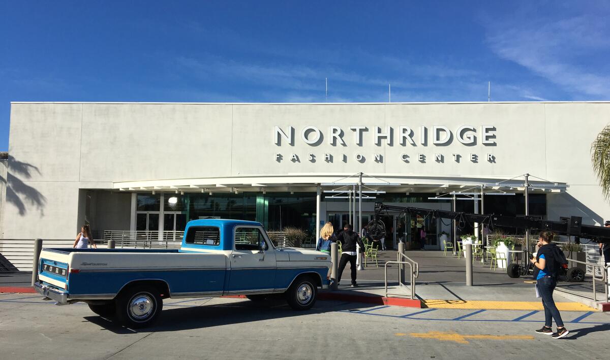 A pickup truck and filming equipment outside Northridge Fashion Center
