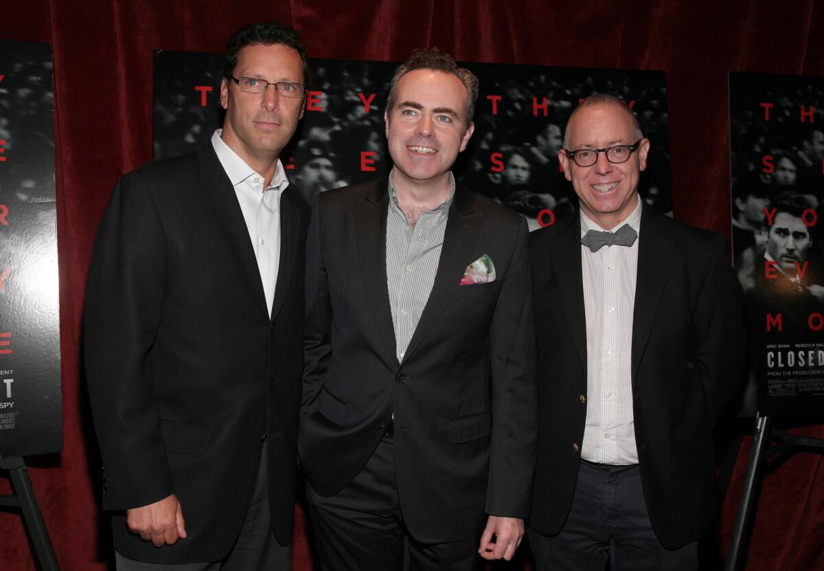 Co-chief executive of Focus Features Andrew Karpen, left, director John Crowley and then-CEO of Focus James Schamus attend a screening of "Closed Circuit" in August in New York.