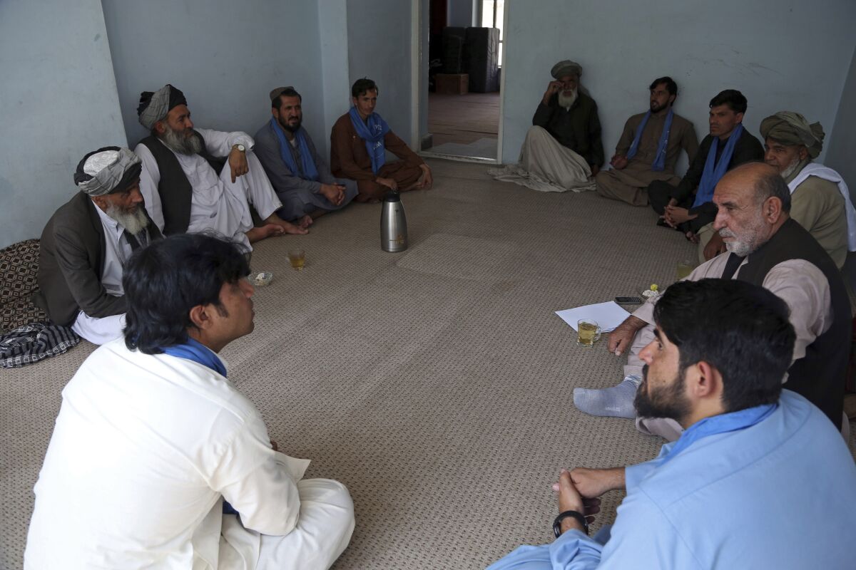 On Tuesday, the Taliban ambushed a peace convoy in Farah province in western Afghanistan and abducted 26 activists, members of a peace movement. Above, members of the peace movement chat after an interview in Kabul, Afghanistan, in August.