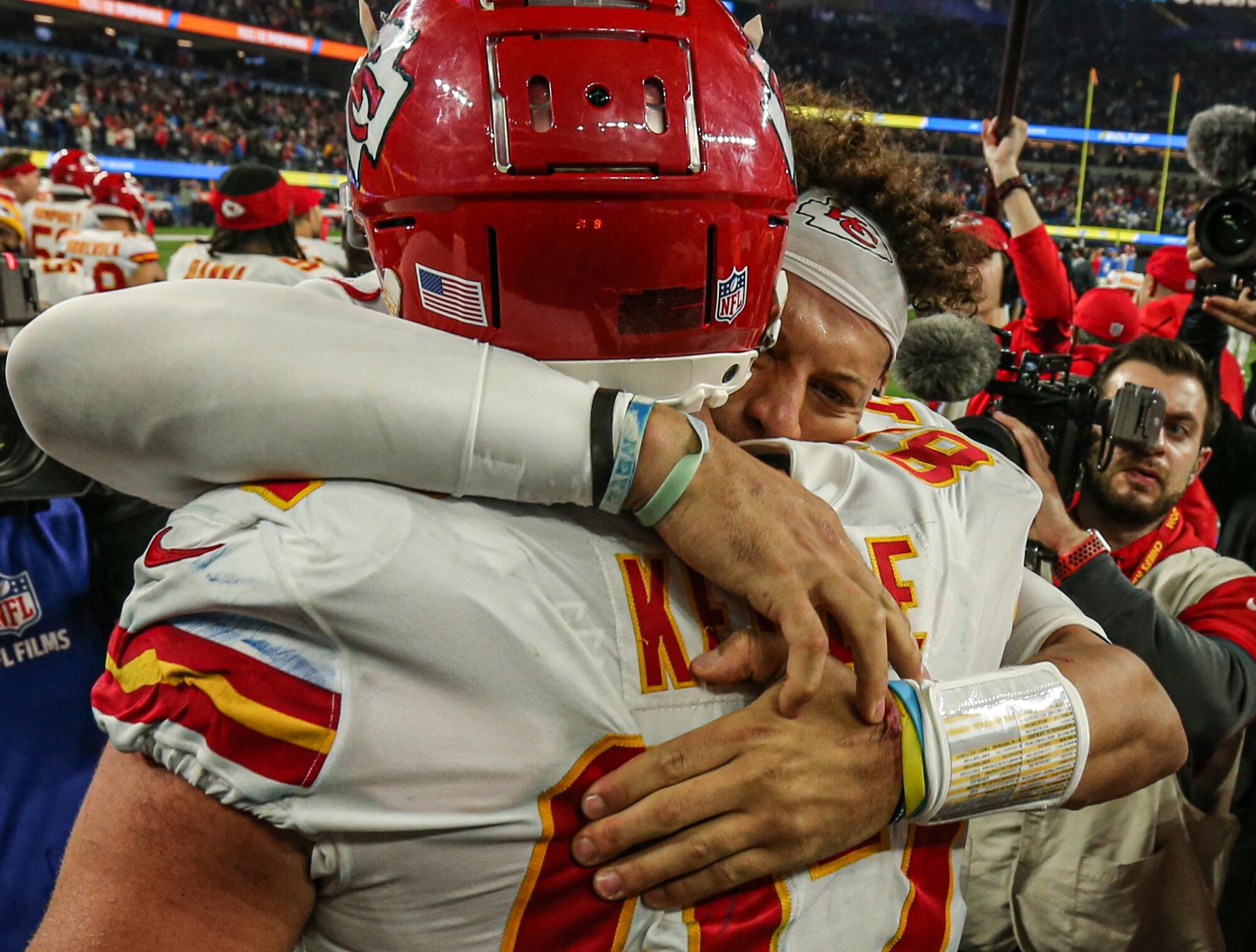 Kansas City Chiefs quarterback Patrick Mahomes celebrates with tight end Travis Kelce.