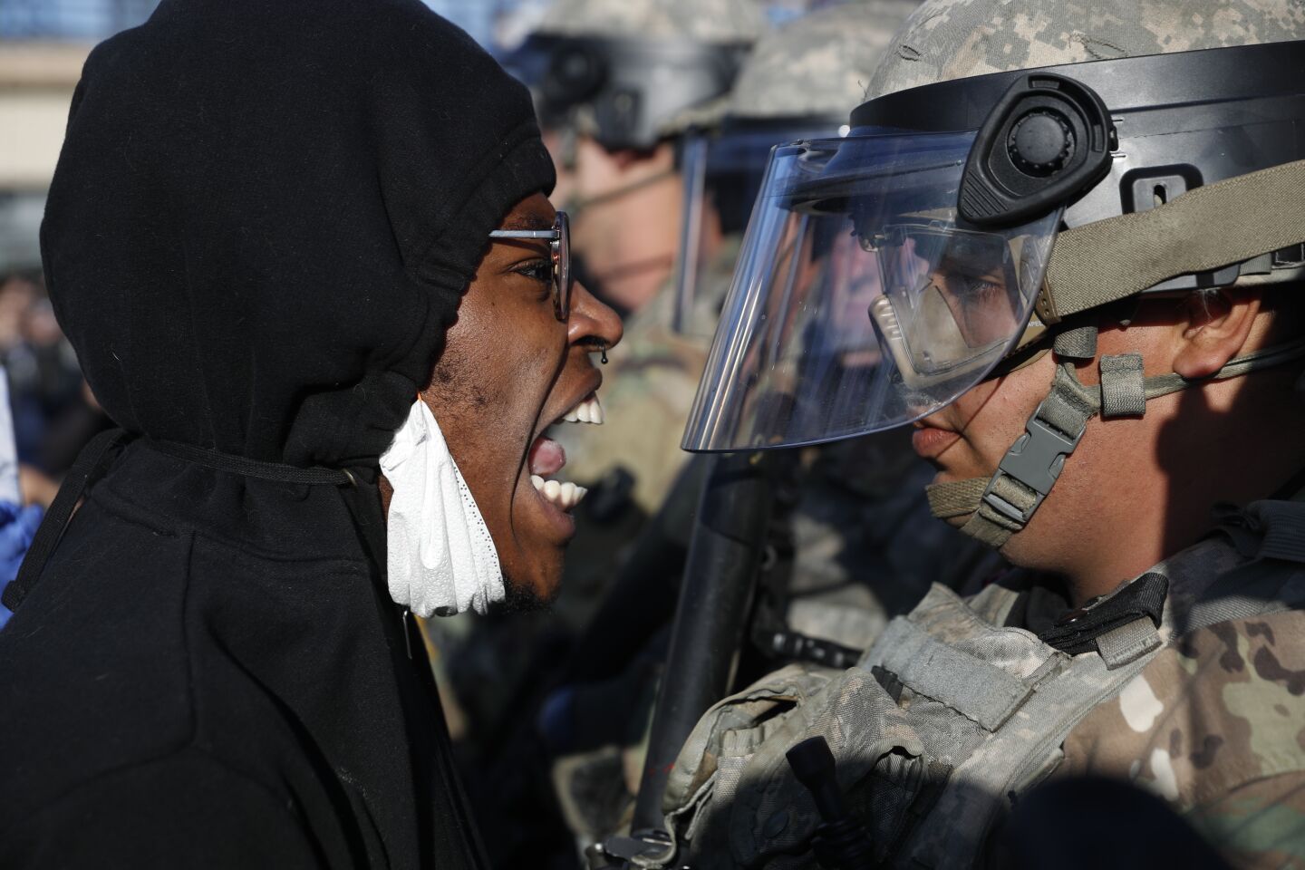 A protester yells at a member of the Minnesota National Guard