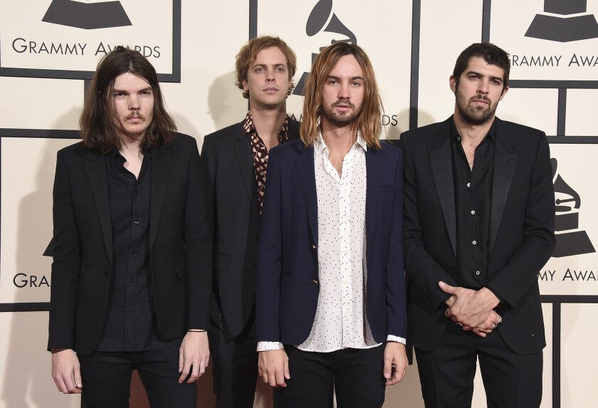 FILE - In this Feb. 15, 2016 file photo, Dominic Simper, from left, Jay Watson, Kevin Parker, and Cam Avery of Tame Impala arrive at the 58th annual Grammy Awards at the Staples Center in Los Angeles. Time can be a comfort or curse. It can heal, but it can also compress, building up a pressure that begs for release. “The Slow Rush” by Tame Impala, seems to be just that — a discharge of the creative pressure that was mounting after years of fans questioning, “What will Tame Impala do next?” The success of the psychedelic rock band’s 2015 “Currents” allowed them to become one of the defining rock groups of the last decade. And with this album, they’ve delivered once again. (Photo by Jordan Strauss/Invision/AP, File)