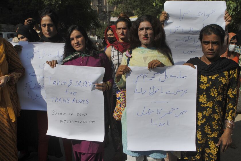 Pakistani transgender persons hold a demonstration demanding for their basic rights, in Hyderabad, Pakistan, Friday, Sept. 30, 2022. Pakistani authorities on Friday in a major move launched a special hotline for the country's largely ignored transgenders in an effort aimed at protecting them from growing incidents of harassment, a government official said. (AP Photo/Pervez Masih)