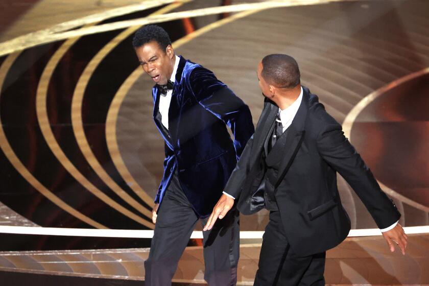 Chris Rock and Will Smith onstage during the 94th Academy Awards at the Dolby Theatre in Hollywood.