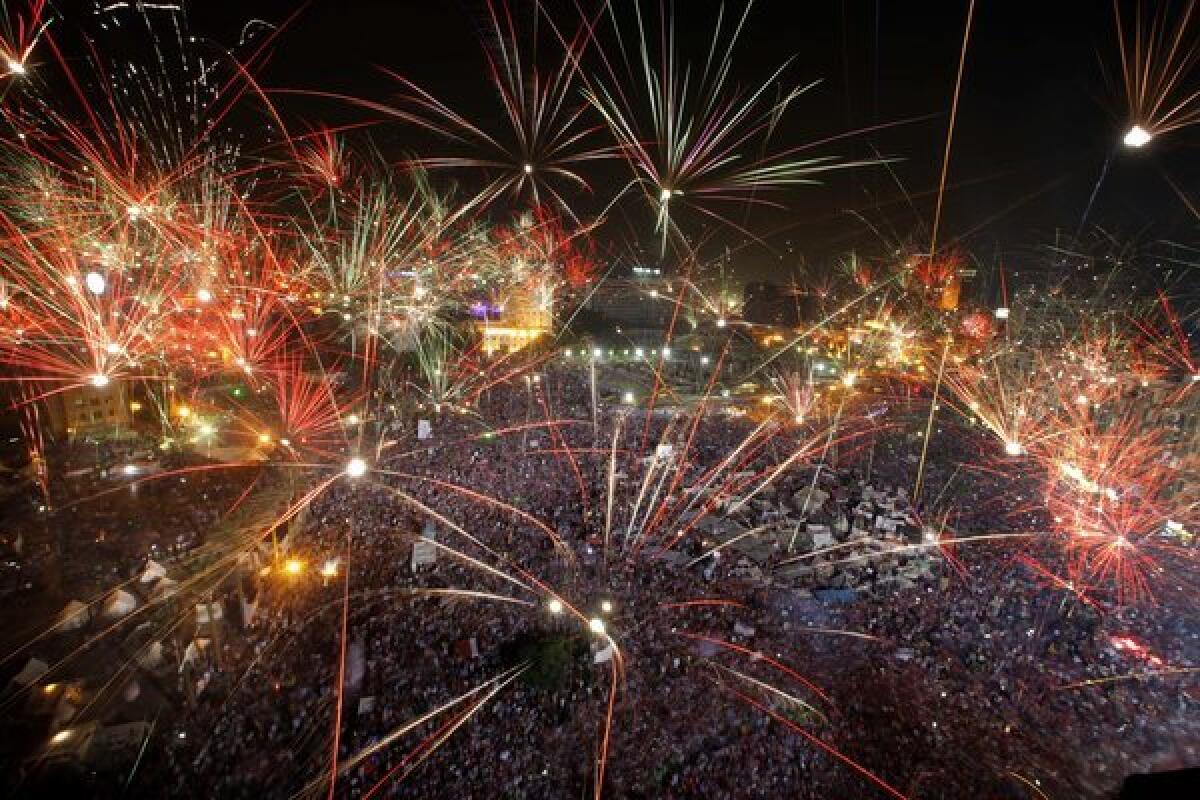 Fireworks light up the sky as opponents of ousted Egyptian President Mohamed Morsi celebrate in Cairo's Tahrir Square.
