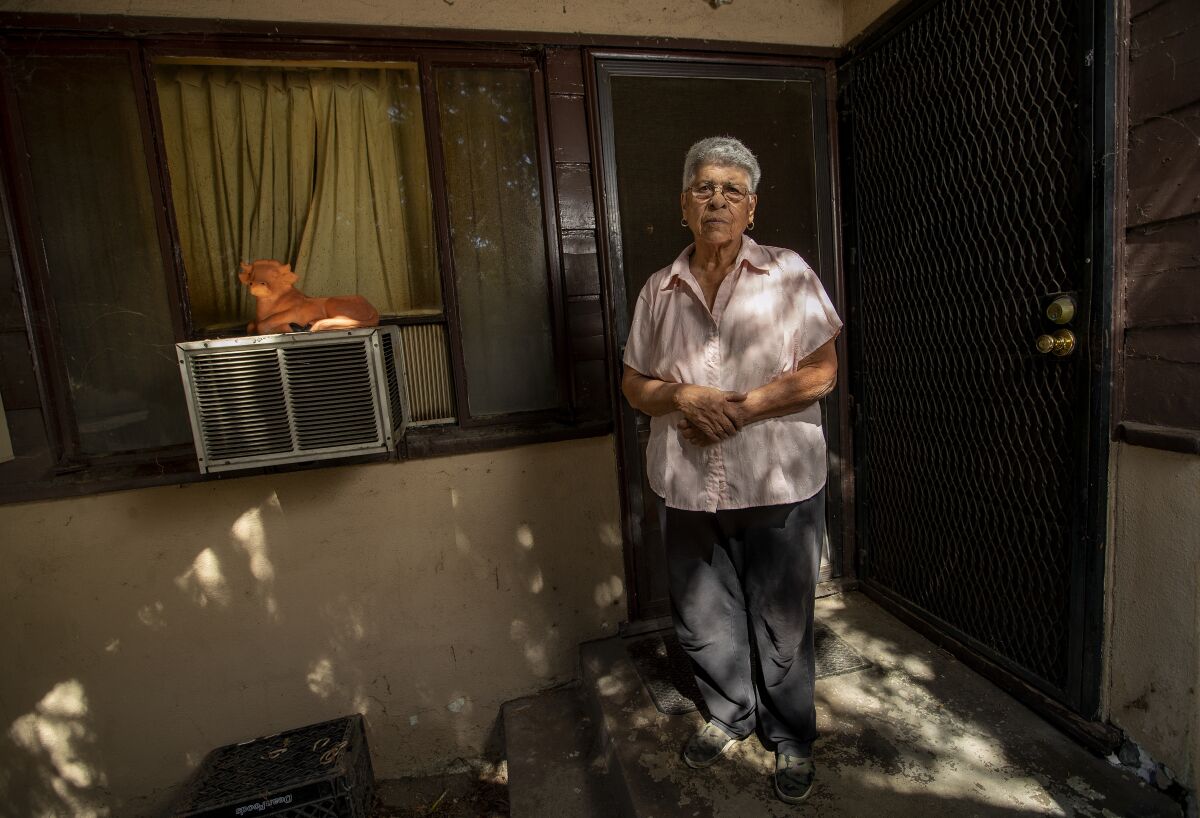 NORTH HOLLYWOOD, CA-AUGUST 3, 2023: Cathy Livas, 77, stands in front of her apartment that she has lived in for the past 40 years on Hartsook St. in North Hollywood. Selling Sunset star Heather Rae El Moussa and her husband, fellow reality TV star Tarek El Moussa are planning a new housing complex that would require the eviction of existing tenants on the site. (Mel Melcon / Los Angeles Times)