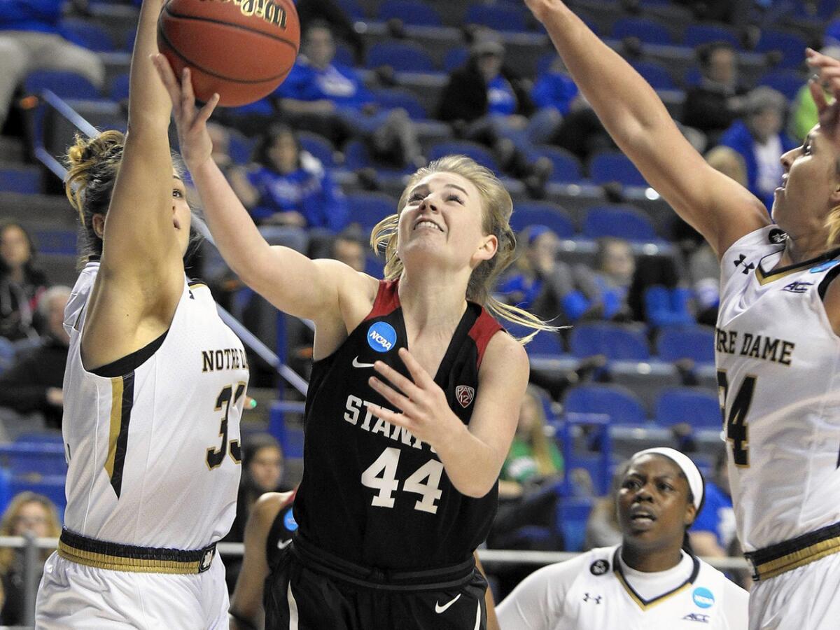 Stanford's Karlie Samuelson (44) shoots between Notre Dame's Kathryn Westbeld, left, Arike Ogunbowale (2) and Hannah Huffman during a regional semifinal game on March 25.