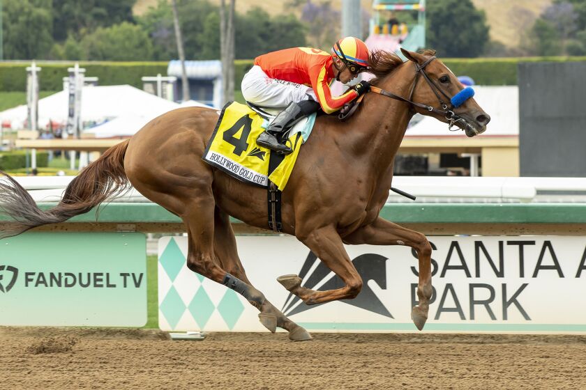 In this image provided by Benoit Photo, Defunded, with Juan Hernandez aboard, wins the Grade.