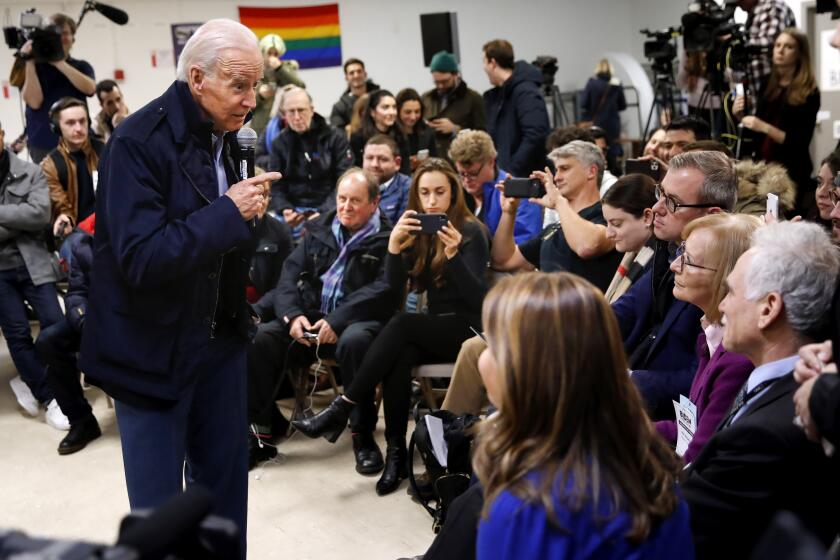 Democratic presidential candidate former Vice President Joe Biden answers questions from members of the media during his visit with supporters at Biden for President Manchester Field Office, Saturday, Feb. 8, 2020 in Manchester, N.H. (AP Photo/Pablo Martinez Monsivais)