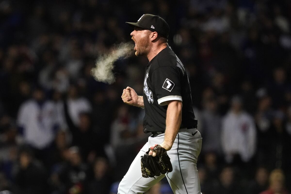 Chicago White Sox relief pitcher Liam Hendriks reacts after striking out Chicago Cubs' Nico Hoerner to end a baseball game Wednesday, May 4, 2022, in Chicago. The White Sox won 4-3. (AP Photo/Charles Rex Arbogast)