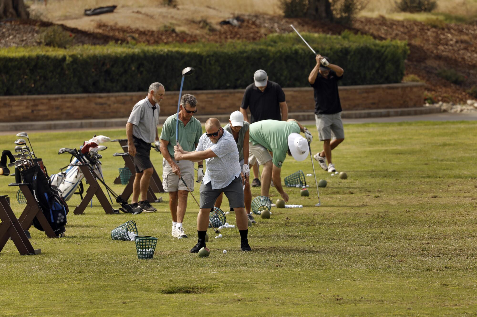 Golfers hit off practice tees at the Rolling Hills Casino and Resort.