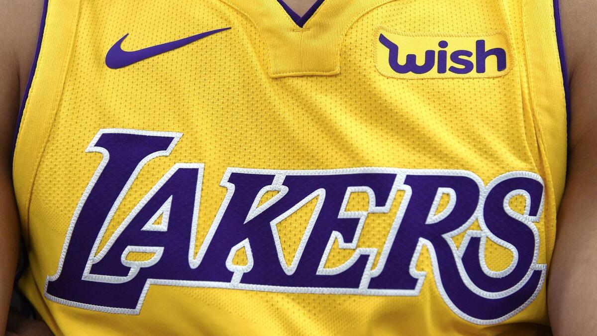 The new Los Angeles Lakers Nike jersey with the sponsor logo "Wish" on the left chest is seen during media day in El Segundo, Calif. on Sept. 2.