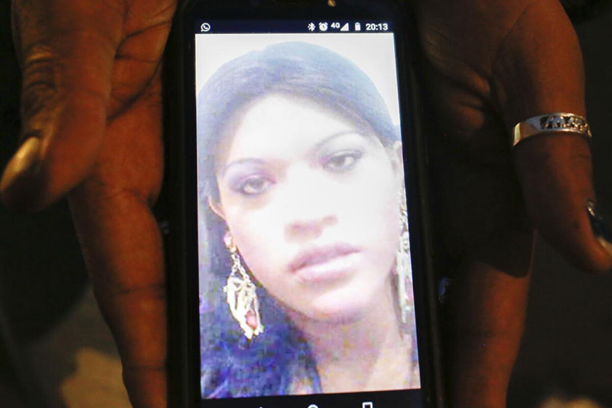 A photo of Paola Buenrostro, a transgender sex worker who was slain in 2016, is displayed on Kenya Cuevas' phone.