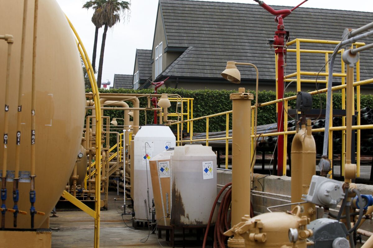 Los Angeles City Atty. Mike Feuer says the city is in settlement talks with AllenCo, the operator of an oil production facility in South Los Angeles that halted operations after neighbors complained that fumes were making them sick. The company wants to resume operations.