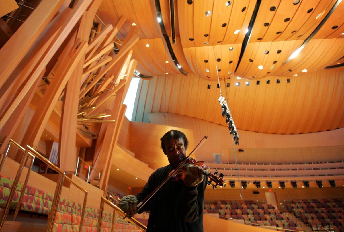 Nathaniel Anthony Ayers plays his violin in Walt Disney Concert Hall in Downtown Los Angeles.