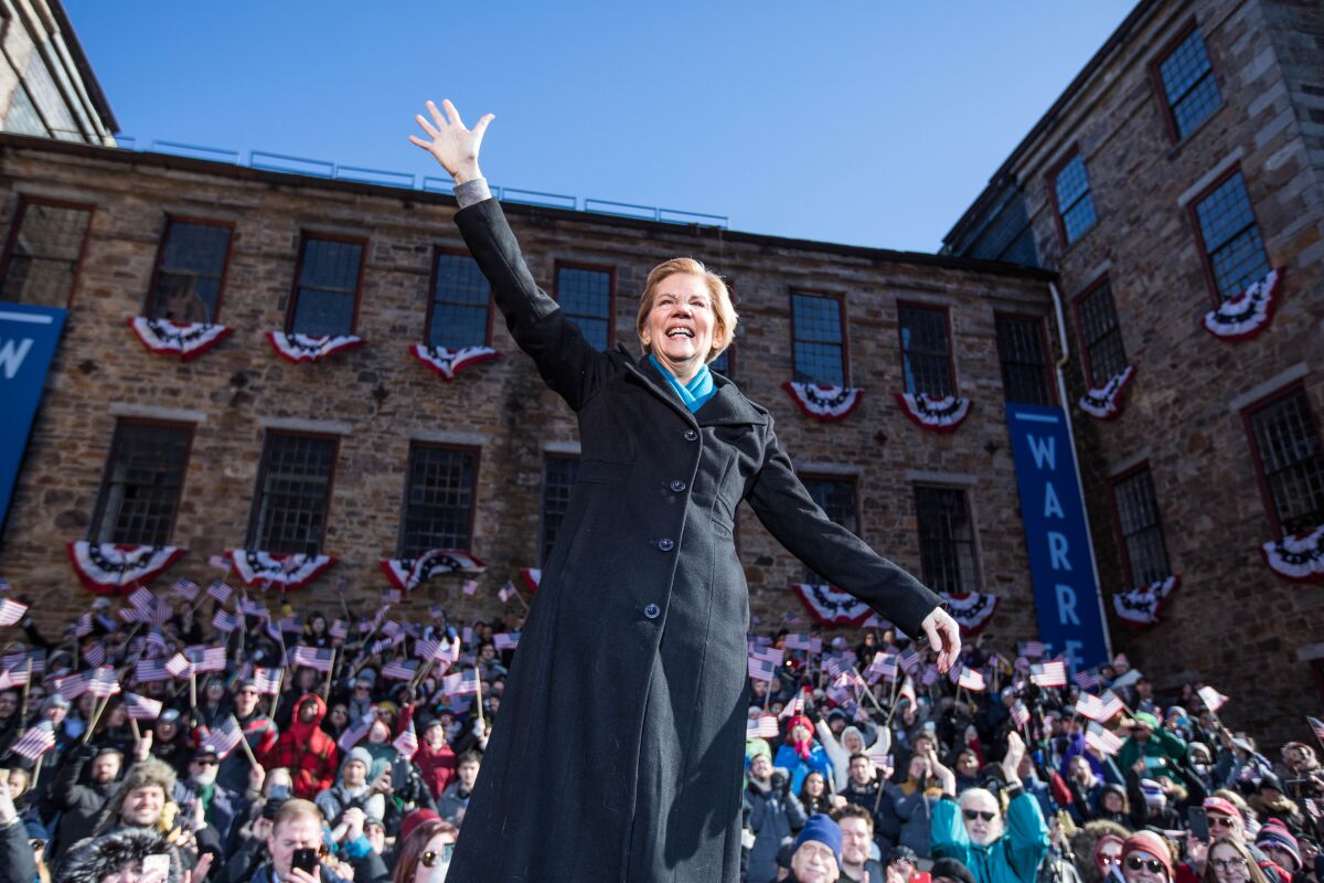 Elizabeth Warren waves to the crowd at a rally in Lawrence, Mass., where she announced her presidential bid in February.