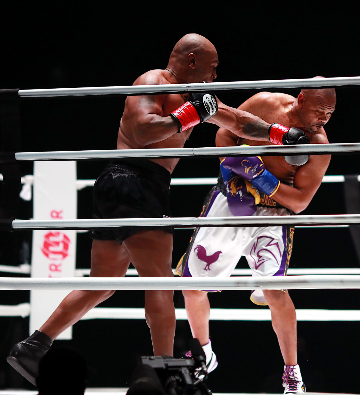 Mike Tyson throws a punch at Roy Jones Jr. during their exhibition fight at Staples Center on Saturday.