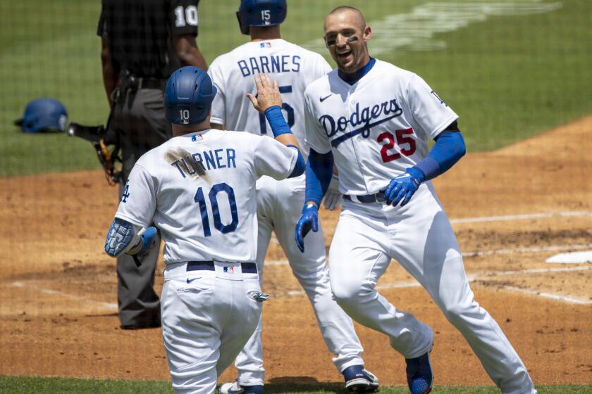 LOS ANGELES, CA - JULY 27, 2022: Los Angeles Dodgers center fielder Trayce Thompson (25) gets a high-five.