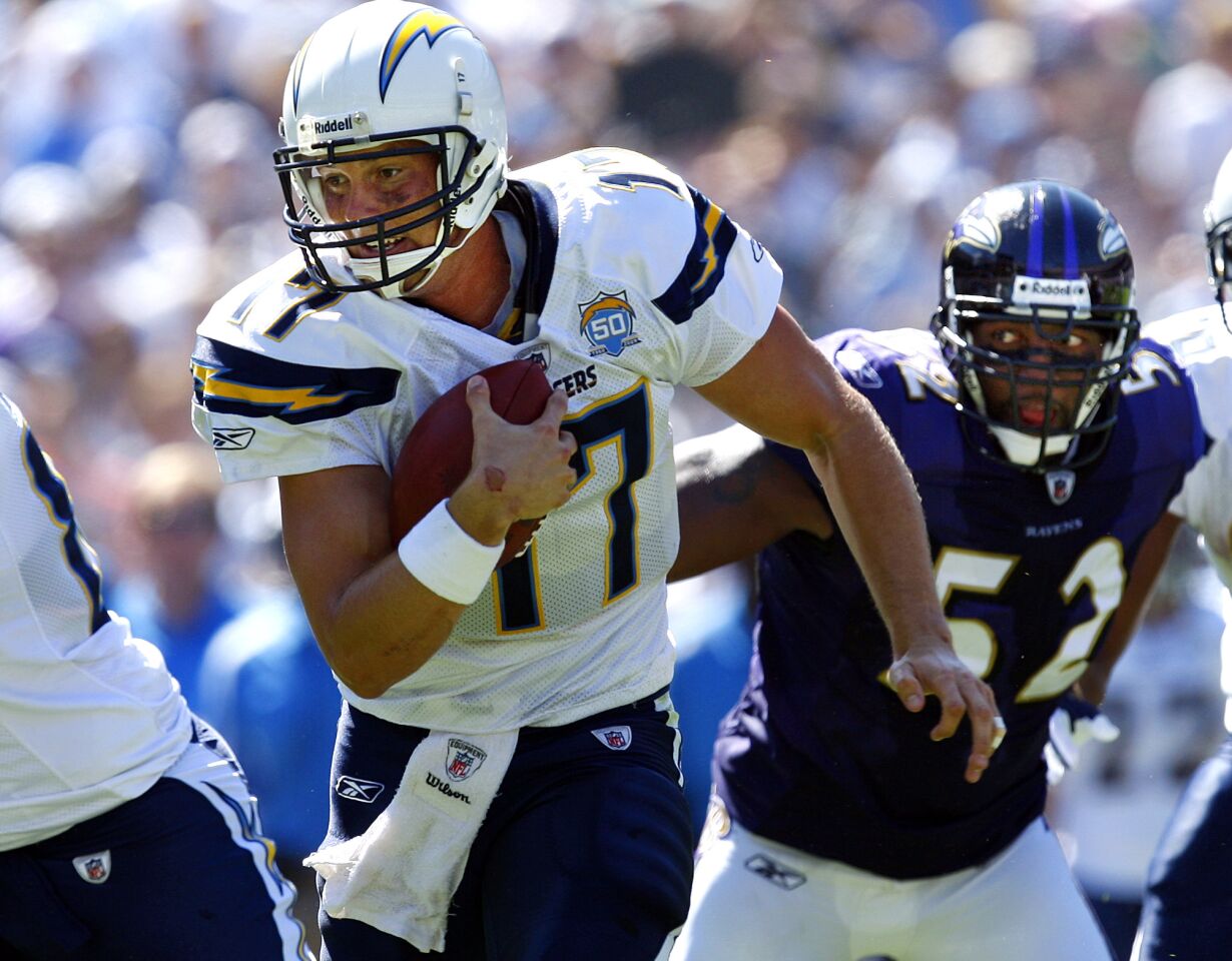 Chargers Philip Rivers runs as Ravens Ray Lewis trials at Qualcomm Stadium on Sept. 20, 2009.