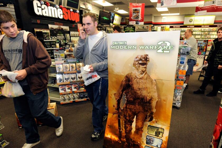 LAS VEGAS - NOVEMBER 10: Gamers get copies of the highly-anticipated video game "Call of Duty: Modern Warfare 2" at a GameStop Corp. store early November 10, 2009 in Las Vegas, Nevada. Video game publisher Activision Blizzard Inc. planned to release the sixth installment in the "Call of Duty" franchise at midnight in 10,000 stores in the United States. (Photo by Ethan Miller/Getty Images) ORG XMIT: 92864004
