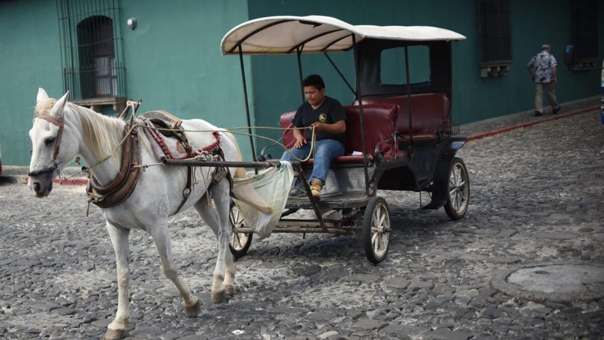 In the driver's seat of a one-horsepower vehicle in Antigua, Guatemala.