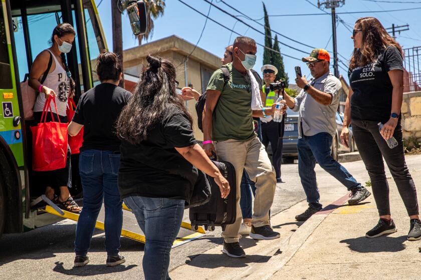 LOS ANGELES, CA - JULY 13: The group of migrants from Brownsville, Texas, arrive St. Anthony's Croatian Catholic Church on Thursday, July 13, 2023 in Los Angeles, CA. (Irfan Khan / Los Angeles Times)