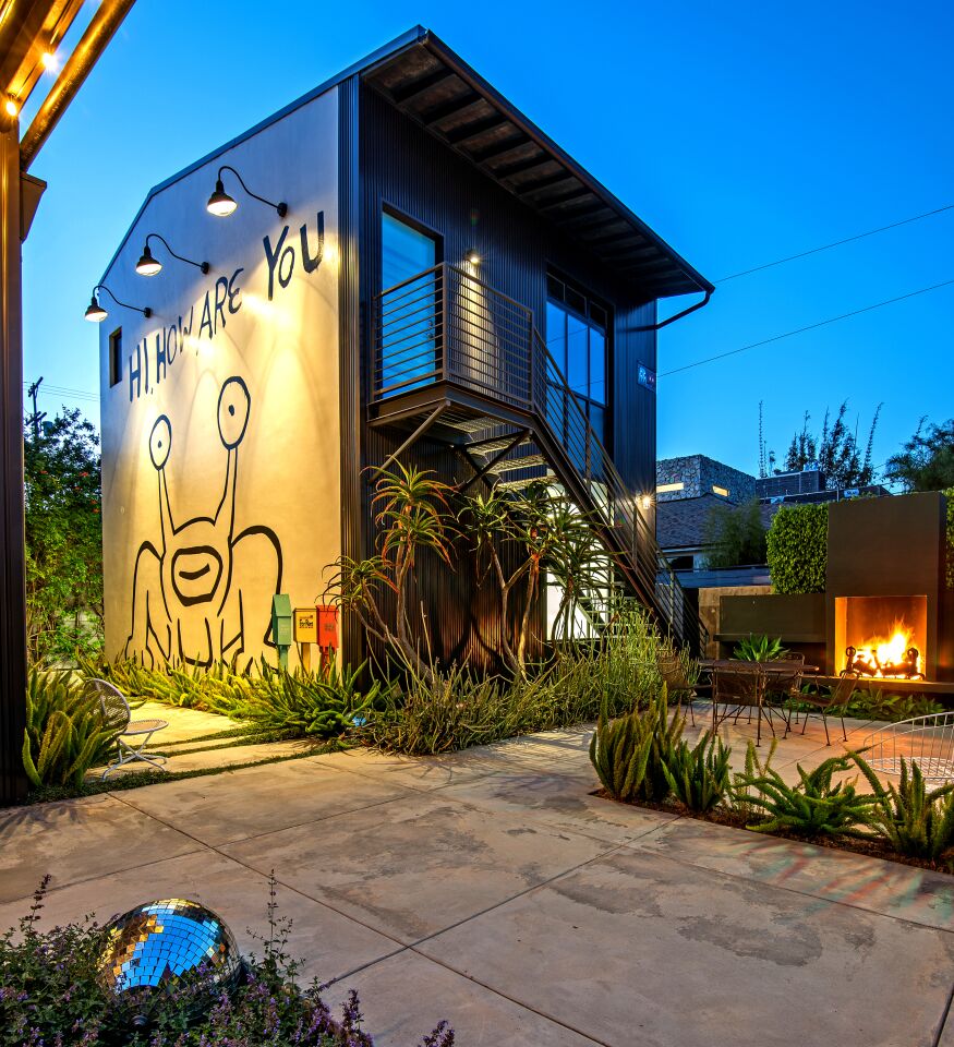 The backyard patio was inspired by the loading dock at Santa Monica's Bergamot Station. Two rooftop decks and a fire pit are among other outdoor features.