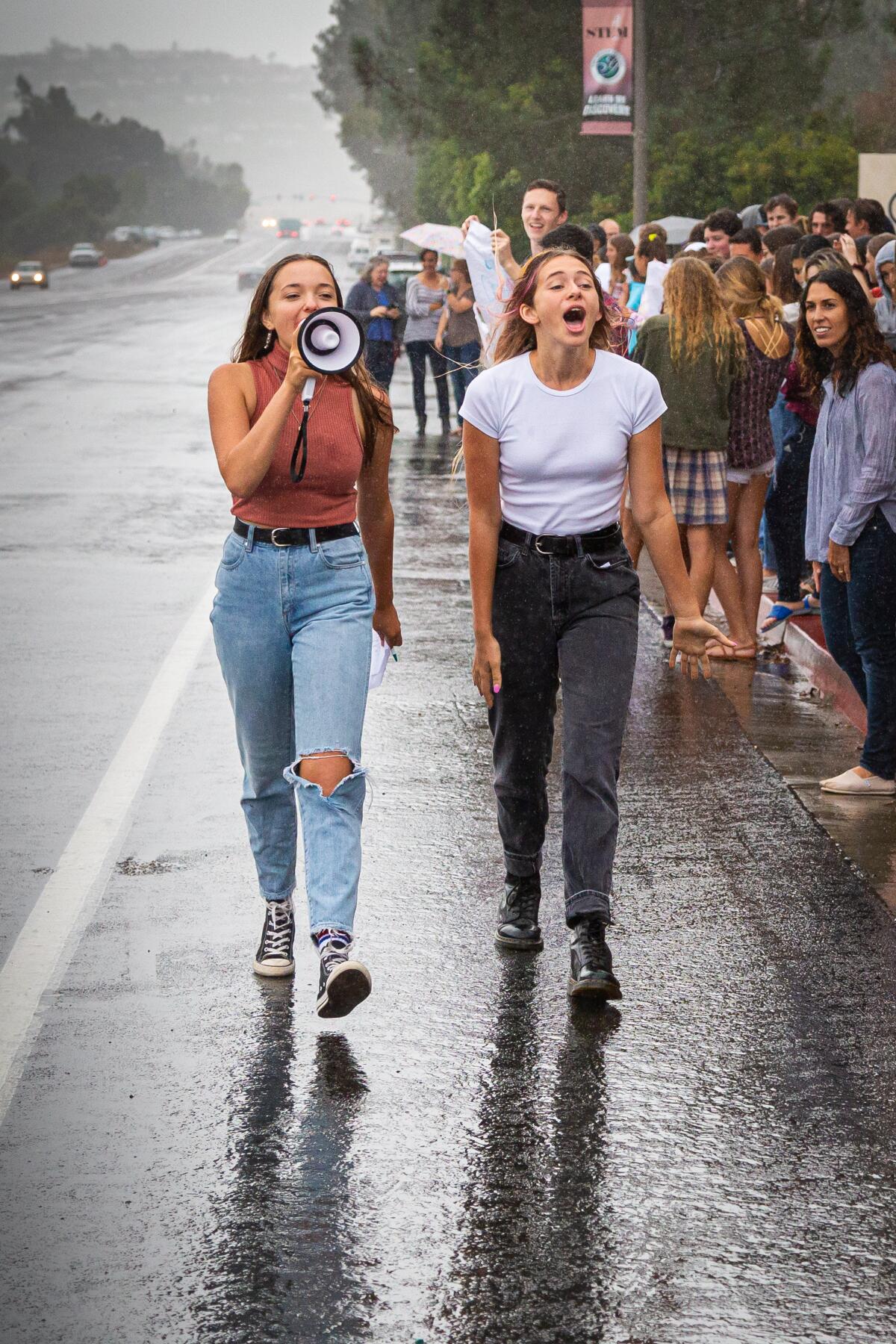 Grauer School students Thalia Miracle and Selah Short participate in the walkout for climate change.