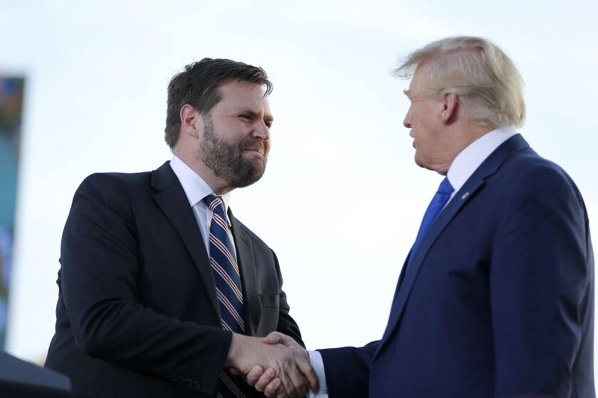 FILE - Senate candidate JD Vance, left, greets former President Donald Trump at a rally at the Delaware County Fairground, April 23, 2022, in Delaware, Ohio, to endorse Republican candidates ahead of the Ohio primary on May 3. High-profile surrogates for Republicans running in Ohio’s hotly contested Senate primary are fanning out across the state or holding other events to give their endorsed candidates a last-minute boost ahead of Tuesday’s election. Sens. Josh Hawley, Ted Cruz and Rand Paul, along with Reps. Matt Gaetz and Marjorie Taylor Greene, were among the conservative emissaries making final pitches in the critical Senate race. (AP Photo/Joe Maiorana, File)