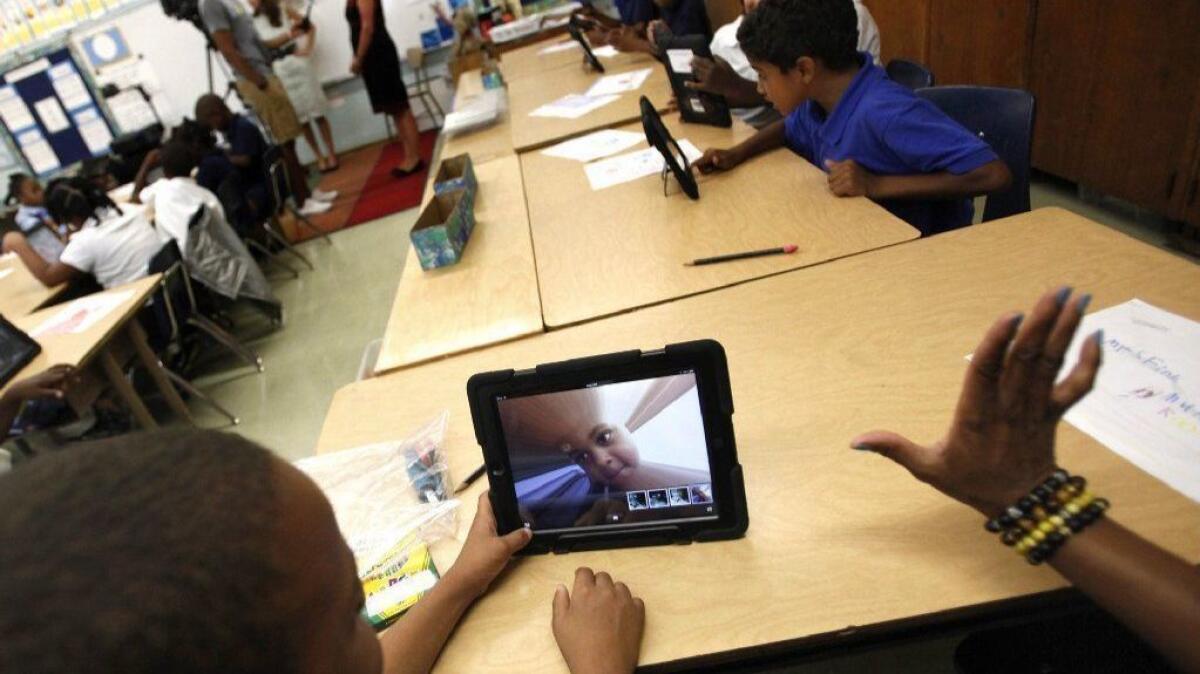 Students at Broadacres Elementary School in Carson explore the features of their LAUSD-issued iPads on Aug. 27, 2013.