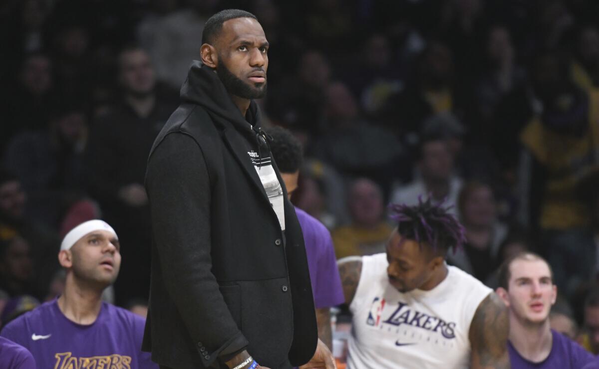 LeBron James was scratched from the Lakers’ lineup with a thoracic muscle strain before Sunday night’s game against Denver.