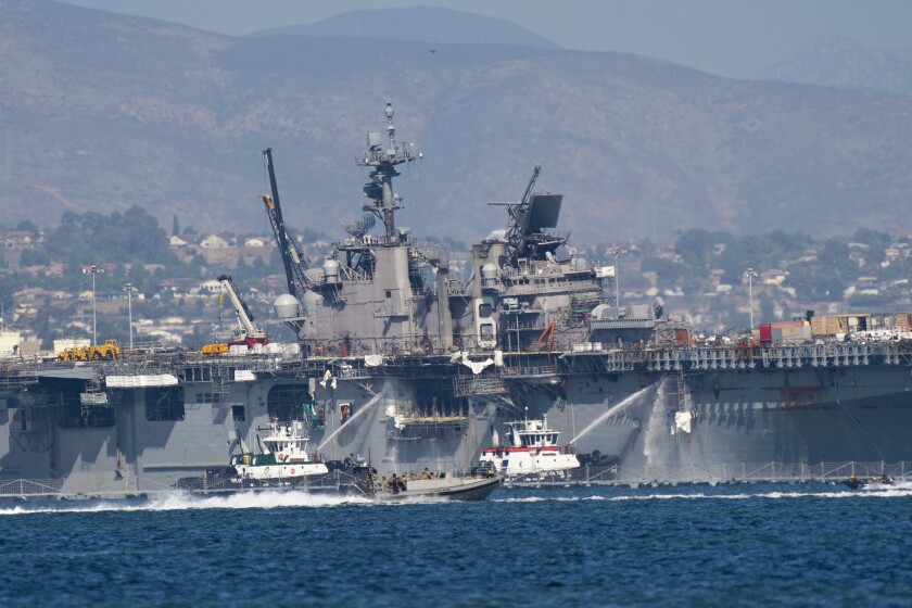 Helicopters continue to assist the USS Bonhomme Richard  Tuesday