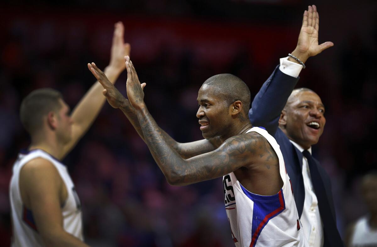 Los Angeles Clippers' Jamal Crawford, center, celebrates his three-point shot late in the 4th quarter that helped seal a win during their game at the Staples Center against the Miami Heat on Wednesday.