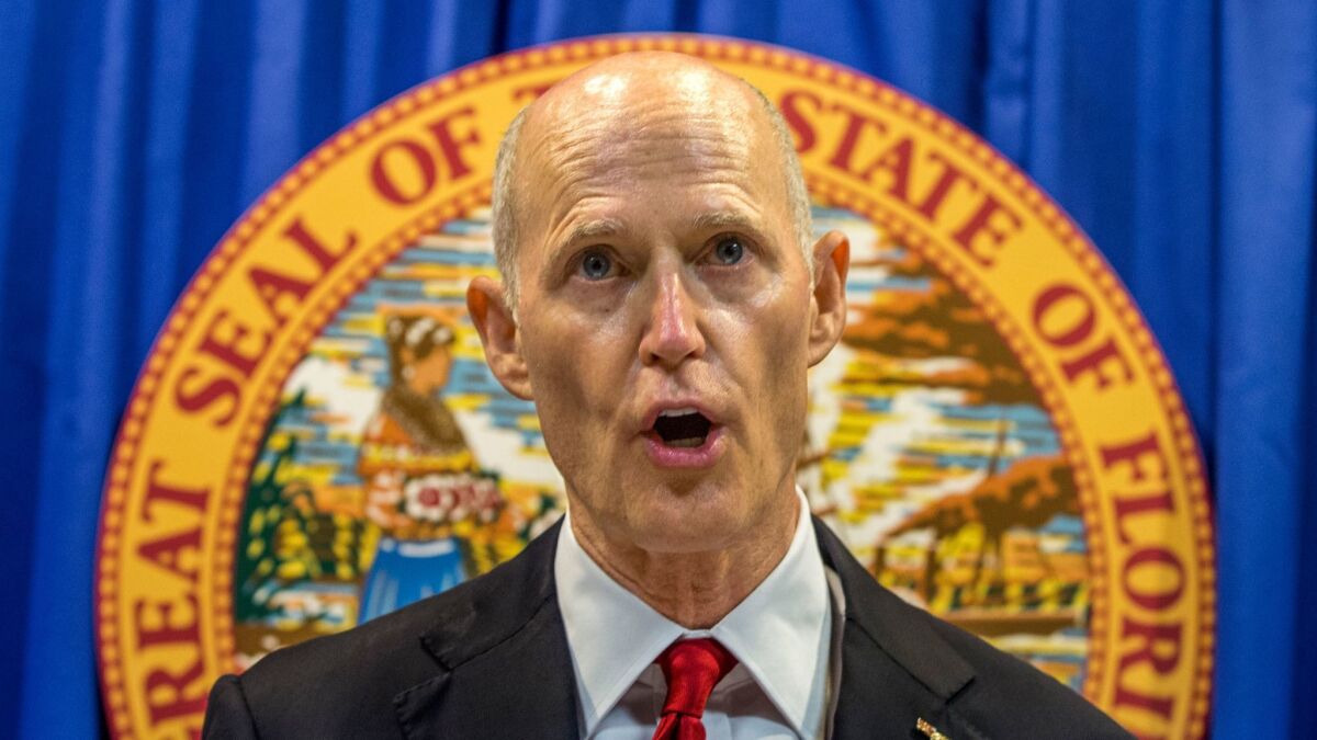 Florida Gov. Rick Scott broke with the National Rifle Assn. on Friday and proposed several gun-control measures in the wake of the Parkland school massacre.