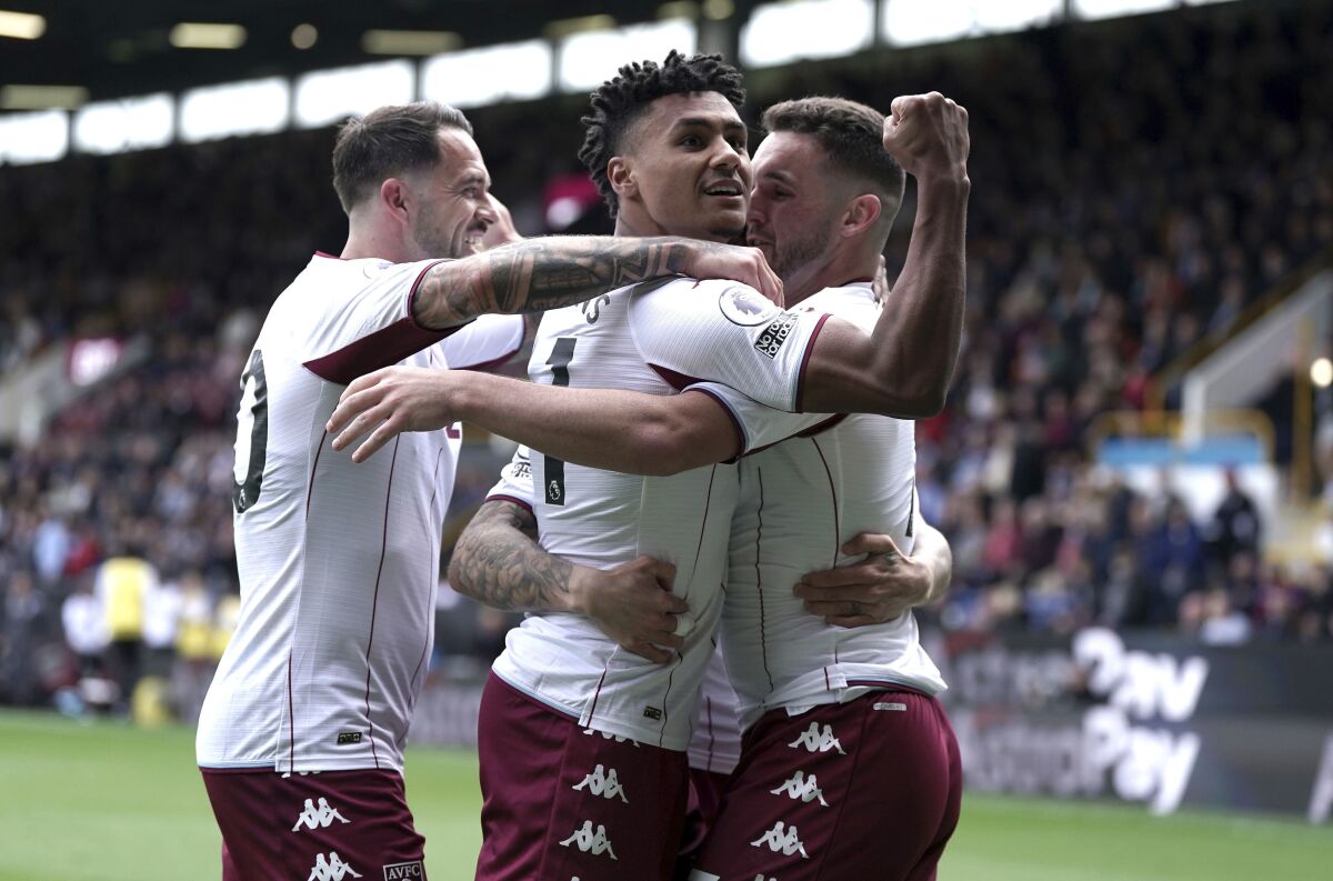 Aston Villa's Ollie Watkins, center, celebrates scoring their side's third goal of the game with team-mates during the English Premier League soccer match between Burnley and Aston Villa at Turf Moor, Burnley, England, Saturday, May 7, 2022. (Nick Potts/PA via AP)