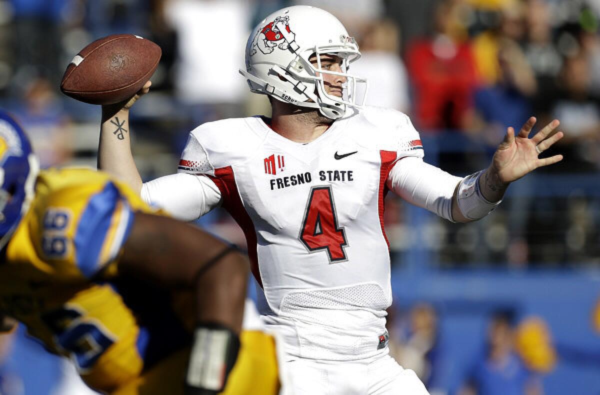 Fresno State quarterback Derek Carr (4) throws for one of his six touchdown passes in a loss to San Jose State on Friday afternoon.